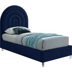 a bed with a blue headboard and foot board