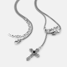 Designed in collaboration with GG Magree, the Love Bite Pendant showcases a scorpion wrapped around a chain, holding a cross with a black onyx stone at its center. This onyx offers protection and strength, while the scorpion symbolizes transformation and lust. The necklace embodies GG Magree's essence, amplifying both protection and sexual energy. Comes on a 45cm (18") stainless steel adjustable rounded box chain with a sterling silver clasp featuring a black onyx stone from the Americas and Asi Black Symbolic Cross Pendant Necklace, Gothic Jewelry With Cross Pendant And Adjustable Chain, Gothic Jewelry With Adjustable Chain And Cross Pendant, Black Symbolic Jewelry With Adjustable Chain, Black Symbolic Cross Pendant Jewelry, Symbolic Black Jewelry With Adjustable Chain, Symbolic Black Necklace With Adjustable Chain, Symbolic Black Cross Pendant Jewelry, Black Engraved Cross Jewelry