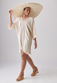 "🚚..ALL ORDERS ARE SHIPPED VIA DHL EXPRESS MAIL Float blissfully through the day in this comfortable relaxed kaftan dress. * Pullover style * V-neck front and back * Dropped shoulder; three-quarters sleeves * Brown stripe fabric front and back panels * Side slits * Unlined * Prewashed, Preshrunk Measurements approximately: Sleeve Length (from side of neckline): 23\" (58 cm) Armhole: 24\" (61 cm)-round Sleeve cuff: 20\" (51 cm)-round Bust: 50\" (127 cm-all around) Hips: 50\" (127 cm-all around) Oversized V-neck Spring Cover-up, Spring V-neck Tunic For Loungewear, Spring V-neck Beach Dress, Chic Cotton V-neck Tunic, Oversized V-neck Tunic For Beach Cover-up, Spring V-neck Beachwear Tunic, Summer V-neck Relaxed Fit Kaftan, Beige V-neck Beach Dress Cover-up, Relaxed Fit Long Sleeve Dress For Beach Season