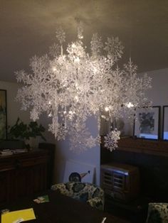 a chandelier hanging from the ceiling in a living room