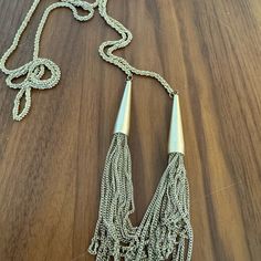 Gold Tassel Necklace. Brand New Condition Party Necklaces With Tassels And Dangle Shape, Chic Silver Jewelry With Tassels, Party Dangle Necklaces With Tassels, Party Tassel Dangle Necklaces, Chic Silver Jewelry With Fringe, Chic Silver Fringe Jewelry, Chic Long Tassel Necklaces, Metal Tassel Necklace With Adjustable Chain As Gift, Silver Metal Tassel Necklace For Party