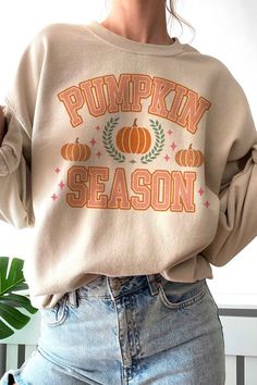 PUMPKIN SEASON Graphic Sweatshirt- Premium 8 oz., 50/50 cotton/ polyester- Air jet yarn for softer feel and reduced pilling- Classic Fit- Unisex Sizing- Designed and printed in Los Angeles Style: CASUAL Print / Pattern: PUMPKIN SEASON Silhouette: SWEATSHIRT Fit: UNISEX Neck Line: CREW Sleeve: LONG Fabric Contents: 50% COTTON/ 50% POLYESTER Stretch fabric Non-sheer fabric Care Instructions: MACHINE WASH COLDLINE DRYSize Measurement (inch): S: 20.0 (Bust), null (Waist), null (Hips), 27.0 (Length) Beige Crew Neck Sweatshirt For Fall, Beige Cotton Sweater For Fall, Trendy Fall Sweatshirt With Screen Print, Fall Loungewear Sweatshirt With Screen Print, Beige Cotton Sweater With Letter Print, Cream Cozy Cotton Sweatshirt, Cream Cotton Sweatshirt With Cozy Fit, Comfortable Cream Tops For Fall, Fall Cotton Sweatshirt With Screen Print