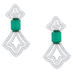 Tresor Diamond Earring features 0.94 cts diamond and 2.76 cts emerald in 18k white gold. The Earring are an ode to the luxurious yet classic beauty with sparkly diamonds. Their contemporary and modern design makes them versatile in their use. The earrings are perfect to be worn daily, at parties, music galas, charity events, conferences, and even weddings. Rectangle Earrings, Charity Events, Diamond Earring, Classic Beauty, Diamond Earrings, Emerald, Modern Design, Jewelry Earrings, White Gold