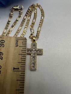 Cross pedant with 18 inch chain. Crystal Cross Pendant Clavicle Necklace, Crystal Pendant Clavicle Chain Necklace, Crystal Cross Chain Jewelry, Crystal Cross Jewelry With Chain, Gold Crystal Rhinestone Cross Pendant Necklace, Gold Cross Crystal Necklace, Gold Cross Necklace With Crystal, Gold Crystal Cross Necklace, Crystal Cross Jewelry With Adjustable Chain