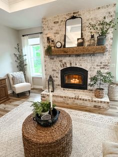 a living room filled with furniture and a fire place in the middle of the room