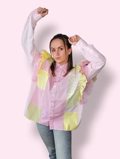 These upcycled handmade shirts are made from men's shirts that could have turned into waste, giving them a second life. The blouse is decorated with charming ruffles, open shoulders give freedom, the pink and yellow pastel tones are easily combined with jeans or classic trousers. Feel the individuality with our unique blouses that combine slow fashion, sustainability and exclusive charm. These handmade shirts will make a great gift for your mother, sister or someone who appreciates a unique hand Spring Long Sleeve Patchwork Blouse, Relaxed Fit Summer Tops With Patchwork, Spring Long Sleeve Patchwork Tops, Fitted Pink Patchwork Blouse, Relaxed Fit Cotton Patchwork Tops, Summer Cotton Tops With Ruffled Collar, Summer Cotton Top With Ruffled Collar, Trendy Fitted Patchwork Blouse, Long Sleeve Patchwork Tops For Summer