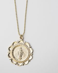 This beautiful necklace features an iconic image of the Roman Catholic icon, the Virgin Mary. *Material: 14k Gold filled chain and clasp with Round Virgin Mary Charm in 14K gold filled ■ MEASUREMENTS: Round disc charm measures approx. 23mm in diameter. 1mm beads chain. # Beautiful Virgin Mary Pendant Mother Mary Catholic Necklace Christian pendant necklace Pray Virgin Mary Gold filled necklace Sterling silver necklace ■ SHIPPING UPGRADES You can find shipping upgrades options in the drop bar men Vintage Gold Medallion Necklace In Sterling Silver, Nickel-free Yellow Gold Medallion Coin Necklace, 14k Gold Medallion Necklace In Spiritual Style, Brass Medallion Jewelry For Commemoration, Vintage Yellow Gold Tarnish Resistant Medallion Necklace, Vintage Yellow Gold Tarnish-resistant Medallion Necklace, Spiritual Medallion Necklace With Vintage Charm, Nickel Free Medallion Jewelry For Commemoration, Vintage Charm Brass Medallion Necklace