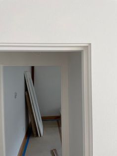 an empty room with no one in it and only the floor is being painted white