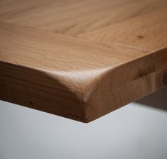 a close up view of a wooden table with no one on it's legs