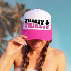 Whether you're lounging poolside, hitting the beach, or simply sipping on your favorite cocktail, these "Thirty & Thirtsy" trucker hats add an extra layer of flair to your beach birthday festivities. They're the perfect accessory for capturing unforgettable memories and creating Instagram-worthy moments! ♥ Product details: .: Sold separately .: Material: 100% polyester foam front with 100% nylon mesh weave back .: One size fits most (22.8"/58cm) .: Adjustable snap closure ♥ Shipping: A tracking Fun Summer Party Trucker Hat, Pink Novelty Trucker Hat For Beach, Pink Novelty Trucker Hat For The Beach, White Summer Party Trucker Hat, Trendy Summer Birthday Hat, Novelty Pink Trucker Hat For Summer, Pink Novelty Trucker Hat For Summer, Novelty Summer Trucker Hat For Beach, Novelty Summer Trucker Hat For The Beach