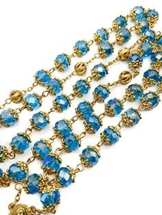 Light Blue Crystal Beads Rosary Handcrafted St. Benedict Rosary with blue crystallized glass beads with Miraculous medal and silver 1.6" Cross. Strong and elegant Rosary made of zinc alloy plated in gold for enhanced durability and corrosion resistance. ensures sturdiness while adding a touch of elegance to the design. Five decades rosary connected to devout 59 beads perfectly designed to hold on during daily usage. wearable for most people, easy to carry in your pocket, bag, or keep in your car Gold Crystal Beads For Gifts, Blue Beaded Metal Jewelry, Blue Crystal Jewelry With Polished Beads, Nickel-free Blue Round Bead Jewelry, Blue Metal Jewelry With Faceted Beads, Blue Jewelry With Gold Beads For Party, Faceted Blue Beads For Gift, Faceted Blue Beads For Gifts, Blue Faceted Round Bead Jewelry