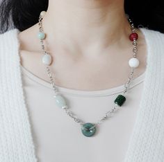 Unleash your urban mystique with the Metropolis Hermit jewelry collection. Featuring a captivating blend of natural gemstones and bold chains, each piece embodies the spirit of a modern-day hermit. Discover the allure of solitude and express your individuality with these edgy and sophisticated designs. ❀ Natural Jade, Jadeite, and Carved Cinnabar Auspicious Clouds❀ Natural Baroque Pearls❀ Natural White Agate Lotus Flower❀ Natural Jadeite Donut❀ Silver Plated Brass Chain and Sterling Silver Clasp Jade Long Necklace With Natural Stones, Long Jade Necklace With Natural Stones, Modern Jade Gemstone Jewelry, Modern Necklaces With Natural Stones For Jewelry Making, Modern Round Natural Stone Necklaces, Modern Handmade Jade Jewelry, Handmade Modern Jade Jewelry, Modern Agate Jewelry With Natural Stones, Asian Jewelry