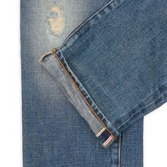 a pair of blue jeans with holes in them