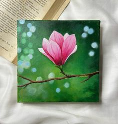 a painting of a pink flower on a branch