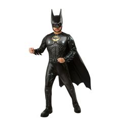 a man dressed as the batman standing in front of a white background