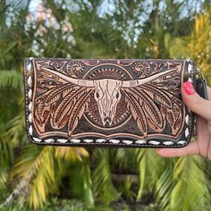 Western leather wallet, tooled leather, hand made, tooled leather western, country girl purse, country girl wallet, zip up leather wallet, cowskull wallet, western wallet, western inspired wallet, longhorn wallet, western fashion, western inspired outfit, western outfit inspo, western purse, western crossbody, western boutique, country girl fashion, country girl outfit, rodeo outfit, rodeo fashion, country concert outfit, country concert outfit inspo, casual country outfit, everyday country styl Hand Tooled Coin Purse, Artisan Hand Tooled Bifold Wallet, Artisan Hand-tooled Bifold Wallet, Brown Hand-tooled Wallets For Everyday Use, Traditional Wallets With Card Slots For Everyday Use, Hand Tooled Bifold Clutch For Everyday Use, Traditional Wallets With Card Slots, Traditional Bifold Wallets For Everyday Use, Traditional Bifold Wallet For Everyday Use