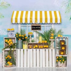 there is a lemonade stand with oranges on display