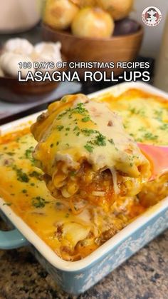 lasagna rolls in a blue casserole dish with the title overlay reads 100 days of christmas recipes lasagna rolls