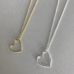 A dainty heart stackable necklace.  Material: sterling silver / 14 karat gold plated  Size: heart 15.2mm / chain 16-18 inch Delicate Heart Beads Necklaces For Everyday, Delicate Everyday Necklaces With Heart Beads, Delicate Heart Beads Necklace For Everyday, Simple Everyday Heart Charm Necklace, Dainty Heart Beads Charm Necklace For Everyday, Everyday Heart Beads Open Heart Necklace, Simple Everyday Charm Necklace With Heart, Dainty Everyday Charm Necklace With Heart Beads, Simple Heart Pendant Necklace For Everyday