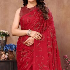 Red colored saree is made from georgette rangoli silk (Poly Silk) fabric which is highlighted with beautiful mukaish work with tassels border as shown. comes along unstitched banglori silk blouse piece which you can customise as per your design/style. Occasion - You can buy this saree for party and functions. Note:- The actual product may differ slightly in color and design from the one illustrated in the images when compared with computer or mobile screen. Measurements: Saree : Georgette : 5.5 Party Saree With Bandhani Print For Eid, Red Saree With Unstitched Blouse For Diwali, Red Bandhani Print Saree For Diwali, Red Georgette Blouse Piece With Zari Work, Elegant Bandhani Print Georgette Saree, Party Wear Bandhani Print Georgette Saree, Party Georgette Saree With Bandhani Print, Red Georgette Traditional Wear For Celebration, Party Saree With Bandhani Print On Georgette