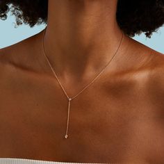 This dainty and sophisticated piece is the perfect addition to any collection! Cheap Gold Teardrop Drop Necklace, 14k Rose Gold Diamond Necklace With Adjustable Chain, Minimalist Teardrop Jewelry With Diamond Accents, Minimalist 14k Yellow Gold Lariat Necklace, Timeless Rose Gold Clavicle Chain Jewelry, Timeless Rose Gold Clavicle Chain, Diamond Lariat Necklace With Delicate Chain, Gold Diamond Dainty Drop Necklace, Single Strand 14k Yellow Gold Jewelry