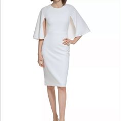 Brand New Calvin Klein White Dress With Cape Attached. Size 8. Capelet Overlay At Bodice. Stretchy And Supportive. Round Neckline. Zip Back. Fitted Calvin Klein Dress For Brunch, Calvin Klein Midi Dress For Brunch, Fitted White Calvin Klein Midi Dress, Calvin Klein White Sheath Midi Dress, Elegant White Calvin Klein Midi Dress, Calvin Klein White Midi Dress For Formal Occasions, Elegant White Calvin Klein Dress, Calvin Klein White Fitted Midi Dress, Calvin Klein White Sheath Dress