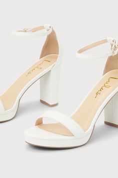 There's nothing you'll love more than how you look in the Lulus Kinsella White Platform Ankle Strap High Heels! These essential heels have a smooth faux leather composition that shapes an almond-shaped toe bed (atop a 0.50"" toe platform) and a slender toe strap. A sturdy heel cup supports a matching adjustable ankle strap that secures with a shiny gold buckle, all atop an eye-catching block heel. 3. 75" wrapped block heel. Cushioned insole. Upper Material: Synthetic. Sole Material: TPR. Man mad Synthetic Heels With Stacked Heel And Almond Toe, Ankle Strap Heels With Sculpted Heel In Faux Leather, Platform Heels With Almond Toe In Synthetic, White Ankle Strap Heels In Faux Leather, Synthetic Platform Heels With Almond Toe, Synthetic Block Heels With Sculpted Heel And Ankle Strap, Synthetic Ankle Strap Heels With Padded Heel, White Faux Leather Heels With 4-inch Heel, White Faux Leather Heels With Block Heel