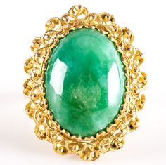 18k Yellow Gold Oval Cabochon Jade Solitaire Cocktail Ring 6.38gMetal Information: 18k Yellow GoldTotal Weight: 6.38gBand Width: 1.95mmSize: 6.5Stone InformationMain StoneGem Type: JadeShape: Oval Cabochon (16mm x 12mm)Color: GreenClarity/Quality: ANumber of Stones: 1Estimated Retail Price: $2005.00OUR PRICE: $1600.00SizingMany of our pieces can be re-sized at the buyers request. Please email us if you require our skilled professional services.45683 Luxury Yellow Gold Emerald Ring With Oval Cabochon, Formal Oval Cabochon Emerald Ring, Formal Emerald Cabochon Ring, Oval Yellow Gold Cabochons For Formal Events, Oval Cabochon Opal Ring With Polished Finish, Oval Cabochon Fine Jewelry With Polished Finish, Polished Oval Cabochon Fine Jewelry, Elegant Gold Domed Cabochons, Oval Cabochon Opal Ring In Fine Jewelry