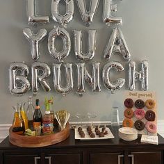 a love you brunch sign with donuts and doughnuts on it