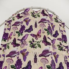 purple butterflies and flowers on white fabric