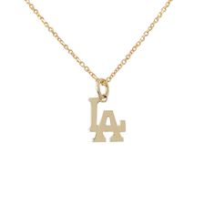 This detailed classic Los Angeles logo charm pendant is composed of 14K solid gold and beautifully complemented by a durable yet delicate 14K solid gold chain, finished with a secure lobster claw clasp and Nana Bijou signature logo tag. This piece is adjustable in length. LA Pendant Dimensions (not including the bail): approximately 6mm (w) x 7mm (h) x 1mm thick Metal Finish: High Shine Polish This design is available in Rose, White and Yellow 14K Gold Please note that this item takes about 1 to Los Angeles Logo, Logo Necklace, Solid Gold Charms, Solid Gold Chains, Rose Gift, Gold Charm Necklace, Charm Pendant Necklace, Unisex Jewelry, Necklace Dainty