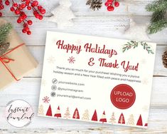 a holiday and thank you card with pine cones, holly branches, and presents on a white wooden background