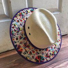 This beautiful Mexican Sombrero has would be perfect to add that special touch to any outfit. MADE IN MEXICO By: Mexican Artisans For: Women Size: Medium 23' Color: off-white | multi Details: Material: palm straw Fabric canvas design Bottom black suede Inner elastic band Contact us for more details PLEASE READ BEFORE PURCHASE: The picture is an ACCURATE REPRESENTATION.Colors in the pictures may vary a little by effects of light. Each product is handmade from Mexico causing differentiation and mi Multicolor Flat Brim Panama Hat For Spring, Adjustable Multicolor Panama Hat For Spring, Multicolor Flat Brim Fedora For Summer, Summer Fedora With Multicolor Flat Brim, Multicolor Summer Fedora With Short Brim, White Straw Woven Fedora, White Woven Straw Fedora, White Woven Fedora With Curved Brim, Multicolor Toquilla Straw Panama Hat For Summer