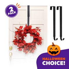 the front door is decorated for halloween with two hooks and a wreath