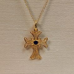 Filigree work handmade Greek cross made of 18 carat solid yellow gold ,Tre cross is adorned with spirals and in the center has blue enamel , It's made in Greece in one of the most famous jewelry workshops that they are specialized making filigree work An elegant small everyday use cross that can be a special gift for any occasion You can also order the cross with different color enamel like green, red, light blue,it will take four working days to preare You can buy the cross with or without the Yellow Gold Filigree Cross Pendant Necklace, Traditional Filigree Cross Jewelry, Byzantine Hallmarked Cross Jewelry, Traditional Cross Jewelry With Intricate Design, Yellow Gold Filigree Cross Jewelry, Byzantine Cross Jewelry, Byzantine Yellow Gold Cross Necklaces, Byzantine Style Yellow Gold Cross Pendant Jewelry, Byzantine Style Cross Jewelry In Yellow Gold