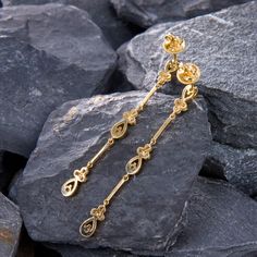 These beautiful textured dangle earrings are bordered with milgrain edging and are each accented with twelve (12) prong/bezel set, round brilliant cut diamonds. The earrings measure 57.0mm in length and 4.6mm in width. The earrings are finished with friction backs for pierced ears. Luxury Gold Linear Earrings With Prong Setting, Luxury Gold Earrings With Bezel Setting, Elegant Bezel-set Drop Earrings, Gold Linear Earrings With Diamond Accents For Anniversary, Elegant Gold Earrings With Bezel Setting, Gold Diamond Earrings With Long Drop Accents, Elegant Bezel Set Drop Earrings, Elegant Yellow Gold Earrings With Bezel Setting, Gold Linear Earrings With Prong Setting For Anniversary