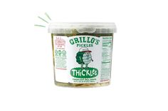 grilled pickles in a plastic container with green sprinkles on top