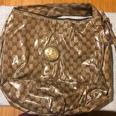 Brown With Gold Hardware. Used With Some Discoloration On The Handle, Around The Meatloaf Logo And The Zipper Sides. Used But In Good Condition. Gucci Bags, Meatloaf, Brown Gold, Womens Tote Bags, Gucci Bag, Gold Hardware, Gucci, Zipper, Women Shopping