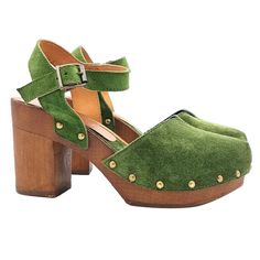 Dutch style clogs, practical and comfortable, perfect for any occasion. Clogs with Brown Wood effect base - Upper in green suede - Adjustable strap - Heel height 9.5 cm and 3 cm plateau - Entirely made by specialized Italian personnel - Handcrafted using the best materials - Very comfortable and elegant. - BEFORE COMPLETING YOUR PURCHASE DO NOT FORGET TO CHECK THE SIZE! Green Suede Closed Toe Sandals, Casual Suede Clogs With Heel Loop, Green Suede Sandals With Round Toe, Suede Clogs With Heel Loop, Green Clogs With Wooden Heel For Spring, Spring Green Clogs With Wooden Heel, Green Leather High Heel Clogs, Green High Heel Leather Clogs, Green Casual Mules With Wooden Heel