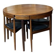 a wooden table with two chairs around it and one chair on the other side that has black leather upholstered seats