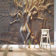 a wall mural with two nude women on it