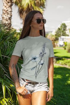 Jump into spring with this comfort colors wildflower oversized tee from an original watercolor by Amy Oberhansley.  Support a real artist while also wearing something unique and high quality.  You come to Etsy to get away from cheap mass fashion. Our shop never uses AI. Every piece is designed, painted and thought out carefully when designing our products. It's the Piece Makers Art difference!  Comfort Colors introduces its garment-dyed t-shirt; a fully customizable tee made 100% with ring-spun cotton. The soft-washed, garment-dyed fabric brings extra coziness to your wardrobe while the relaxed fit makes it an excellent daily choice. The double-needle stitching throughout the tee makes it highly durable while the lack of side-seams helps the shirt retain its tubular shape. .: 100% ring-spu Comfort Colors Shirt, Oversized Tee, Graphic Tees Women, Dye T Shirt, Comfort Colors, San Jose, Graphic Tee, Vintage Style, Graphic Tees