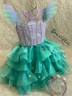 a dress made out of tulle and beads