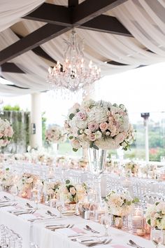 an elegant wedding setup with white and pink flowers