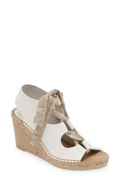 Braided trim highlights the wedge heel of a lofty sandal that laces up with a woven fabric strap. 3 1/4" heel; 3/4" platform (size 38.5) Lace-up style Leather upper and lining/rubber sole Imported White Espadrille-style High Heel Wedge Sandals, Espadrille Wedge Sandals With Wrapped Heel, White Straw Wedge Sandals With Woven Sole, White Espadrille High Heel Wedge Sandals, White Espadrille Wedge Sandals With High Heel, White Platform Lace-up Sandals For The Beach, White Espadrille Heels For Vacation, Chic White Espadrille Heels, Espadrille Wedge Heel With Wrapped Heel