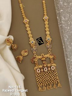 Description :- South Indian Jewellery Set /Temple Jewelry Set /Choker Necklace / Choker Set/ Bollywood Jewelry/ Indian Jewelry/ Gifts Perfect for Indian weddings. All the raw material used in this product is of high quality and is handcrafted with love. Premium Quality and High craftsmanship 100% Satisfaction Guarantee: Long Lasting Plating, High-Quality Stones. Gifting: This pair of charming necklace and earrings come in a beautiful gift box, making it an ideal gift for birthday, wedding annive Golden Set Jewellery Design, Indian Jewellery Set, Unique Gold Jewelry Designs, Mangalsutra Design, Black Beads Mangalsutra, Black Beads Mangalsutra Design, Temple Jewelry, Mangalsutra Designs, Indian Jewelry Sets