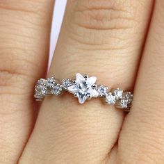 ✩ Solid 925 sterling silver. Good for sensitive skin. ✩ Rhodium plating gives the ring extra shine and durability ✩ Finest diamond simulants ✩ Center stone is a star CZ ✩ Main stone carat weight: 0.75 ✩ Shank width 2 mm ✩ Approx. weight: 2.2 g ✩ Ship beautifully packaged We only choose the finest diamond simulants (CZ 5A) on the market, with a breathtaking level of brightness like real diamonds. Our jewelry can be found in stores and boutiques in Illinois, Indiana and Wisconsin. We always believ Starburst Ring, Star Celestial, Clean Sterling Silver, Celestial Ring, Ring Cluster, Celestial Jewelry, Diamond Simulant, Star Ring, Etsy Jewelry