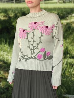 Life is too short to wear boring clothing! This unique embroidered sweater is a one-of-a-kind piece that will truly make you stand out from the crowd. Handcrafted from the highest quality Italian merino yarn, the extremely cosy crewneck features a loose fit and cute 3D decoration in floral motives to create an eye-catching look. DETAILS -Relaxed fit. -Crewneck. -Long sleeve. -Hand-knitted and hand-embroidered. -       Unique, one-of-akind -       Colour: light green Designed and ethically made i Fall Sweater With Multicolor Embroidery And Long Sleeves, Fall Long Sleeve Sweater With Multicolor Embroidery, Long Sleeve Sweater With Multicolor Embroidery For Fall, Spring Sweater With Multicolor Embroidery And Long Sleeve, Multicolor Embroidered Long Sleeve Spring Sweater, Fitted Cotton Sweater With Floral Embroidery, Fitted Long Sleeve Sweater With Floral Embroidery, Fitted Crew Neck Sweater With Floral Embroidery, Fitted Embroidered Sweater For Fall