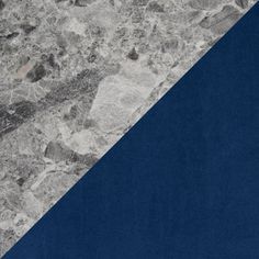 a blue and gray marble wallpaper with two diagonal stripes in the center, on top of each other