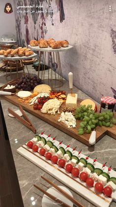 an assortment of appetizers and snacks are displayed on a table in a restaurant